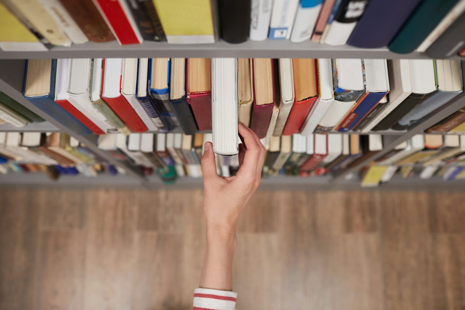 Student taking Book in Library